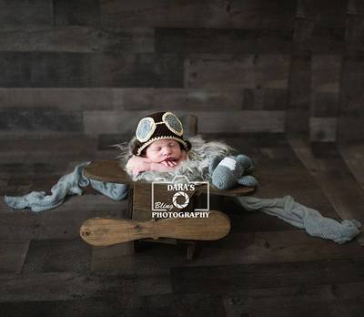 Parkland birth photographer IVF newborn baby boy pilot hat in airplane