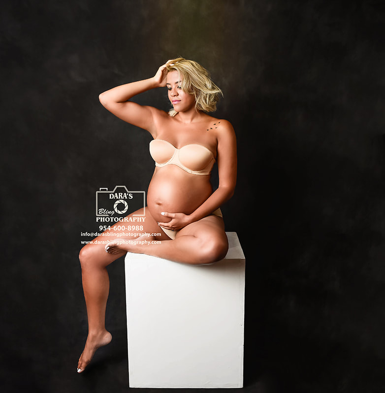 glamour nude maternity photo mom sitting on white box bra and underwear