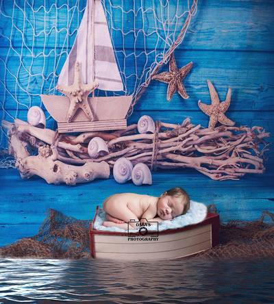 newborn baby boy nautical newborn session baby in boat