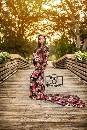 floral pregnancy gown maternity session on wooden bridge at Tree Tops Park in Davie Dara's bling photography maternity sessions