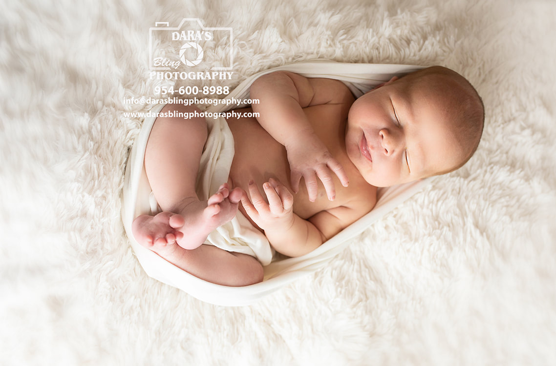 newborn Christmas photo shoot with candy cane