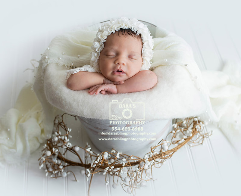 How do I choose the best newborn photographer for my baby