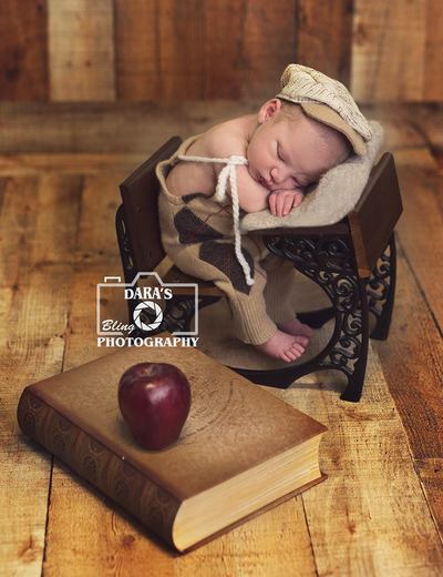Sunrise Florida birth photographer newborn baby boy sitting at desk apple and book