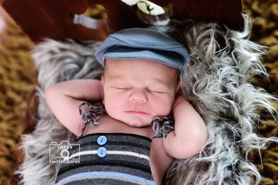 Pompano beach newborn baby boy photography session on bed grey fur and hat