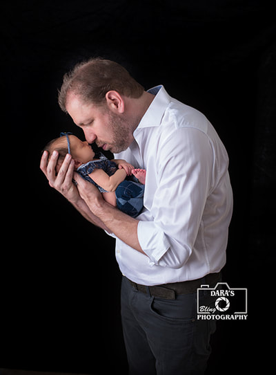 Boca Raton newborn photography father and daughter kisses