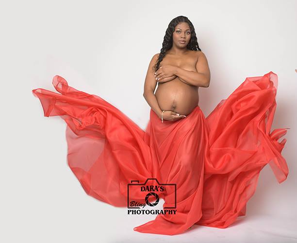 semi nude maternity portrait red flowing fabric Hallandale Beach photographer