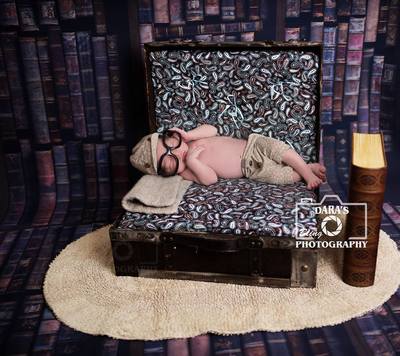 Miami newborn photography newborn in suitcase with library book