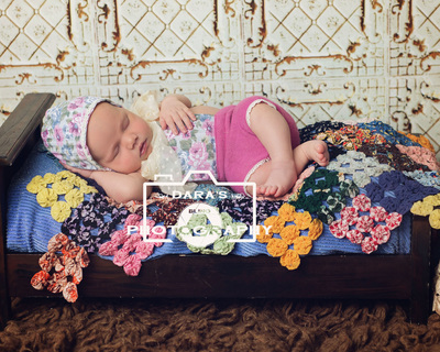 newborn photographer coral springs IVF newborn baby girl on antique quilt bed